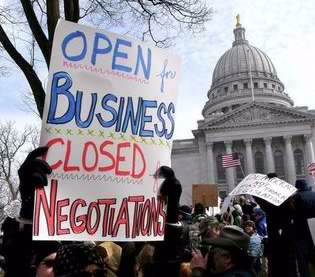 Madison State Capitol with Protest Sign: 'Open for Business, Closed to Negotiations'