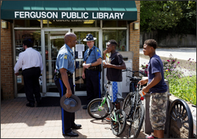Missouri Highway Patrol Captain Ron Johnson visits a Ferguson Public Library school program in Ferguson, Mo.