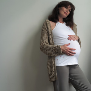 Pregnant Woman Holding Stomach