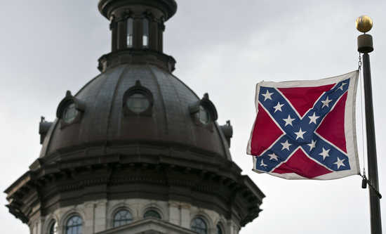 A Confederate flag flies outside the South Carolina State House in Columbia, South Carolina January 17, 2012. REUTERS/Chris Keane (UNITED STATES - Tags: POLITICS) - RTR2WFA7