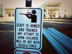 A private school in Arizona has some staff returning to school with guns and this new sign posted on campus. What do you think? 