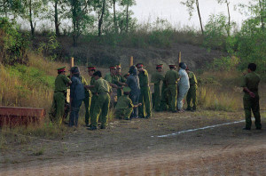 Preparing execution of criminals by firing squad.