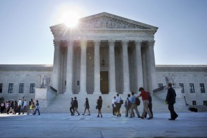 People enter the Supreme Court in Washington, Monday June 29, 2015. The Supreme Court is meeting for the final time until the fall to decide three remaining cases and add some new ones for the term that starts in October.  The three remaining cases that are expected to be decided Monday raise important questions about a controversial drug that was implicated in botched executions, state efforts to reduce partisan influence in congressional redistricting and costly Environmental Protection Agency limits on the emission of mercury and other toxic pollutants from power plants.  (AP Photo/Jacquelyn Martin)