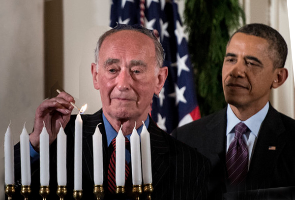 President Barack Obama watches as Martin Weiss, a Holocaust survivor, lights a menorah during a Hanukkah reception in the White House, Dec. 5, 2013.