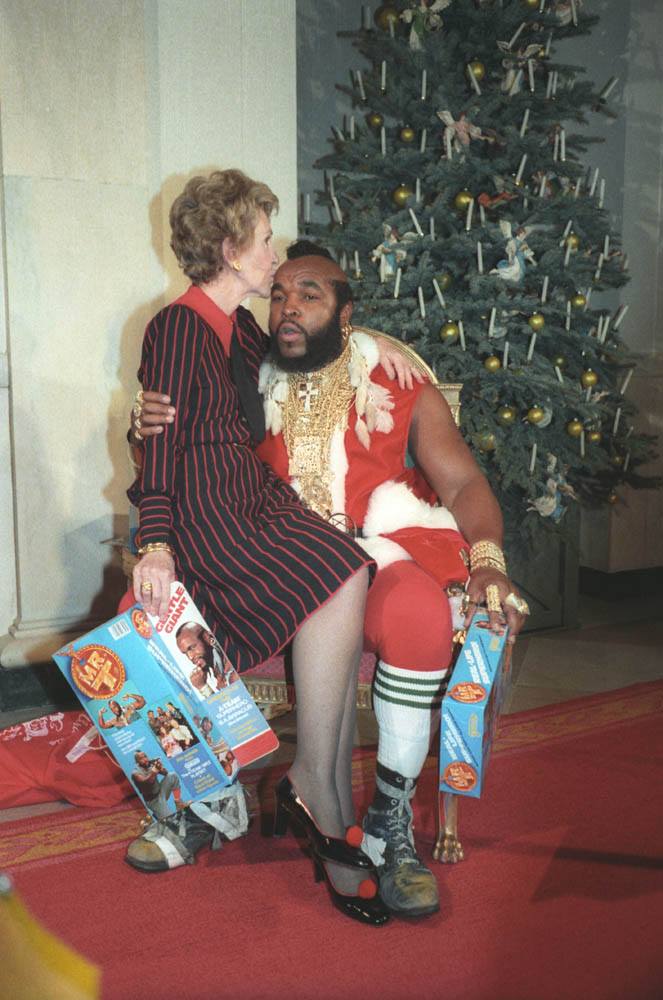 Yes, this really happened! In 1983, First Lady Nancy Reagan sat on the lap of Santa Claus (otherwise known as Mr. T) after reviewing the White House Christmas decorations with the press. Photograph from the Ronald Reagan Presidential Library.