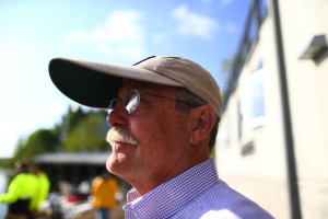 Bob Ernst, the women's head rowing coach at the University of Washington, and the director of the program at teh school, is seen watching the activities at the Conibear Shellhouse before the start of the 2015 Windermere Cup on Saturday, May 2, 2015. His team would later win the Windermere Cup, rowing against the University of Virginia. WINDERMERE CUP - 146811 - 050215