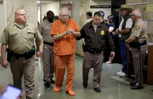 Former Tulsa County Sheriff's Office reserve deputy Robert Bates is escorted from court after his request for bail was denied May 3, 2016.Bates was convicted of 2nd degree manslaughter in the shooting death of Eric Harris. MIKE SIMONS/Tulsa World