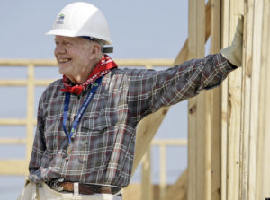 Former President Jimmy Carter leans on a wall as he helps build a Habitat for Humanity house in Violet, La., Monday, May 21, 2007. Carter was working on the 1000th Habitat for Humanity house in the Gulf Coast region since hurricane Katrina and Rita.   (AP Photo/Alex Brandon)