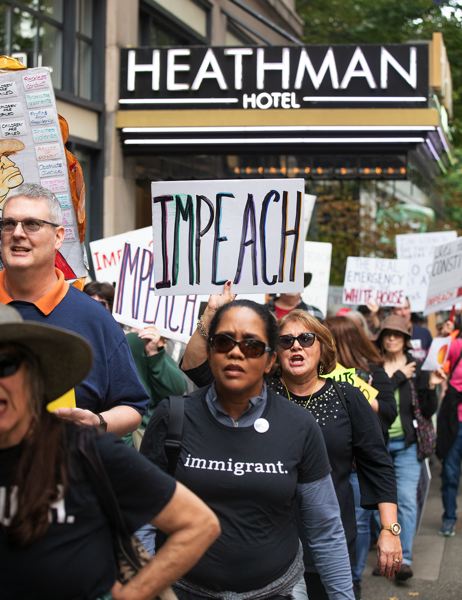 PMG PHOTO: JONATHAN HOUSE - Protesters march around the Heathman Hotel, where they rallied against owner Gordon Sondland.